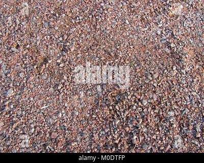 Abstrakte Makro grit Hintergrund - Oberfläche, mit kleinen Steinen bedeckt Stockfoto