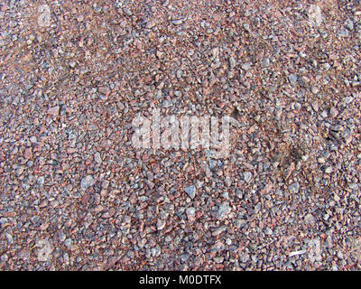 Abstrakte Makro grit Hintergrund - Oberfläche, mit kleinen Steinen bedeckt Stockfoto