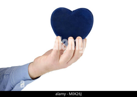 Des Menschen Hand blaues Herz Stockfoto