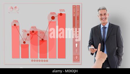 Hand ein Geschäftsmann auf grauem Hintergrund mit Grafik Stockfoto