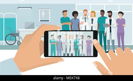 Professionelles medizinisches Personal und Ärzte gemeinsam im Krankenhaus posiert, ein Mann ist, ein Foto mit einem Smartphone, einem subjektiven Sicht Stock Vektor