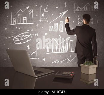 Eine junge marketing Büroangestellter Zeichnung Kreisdiagramm und Grafik auf der Mauer auf der Tagung Konzept Stockfoto