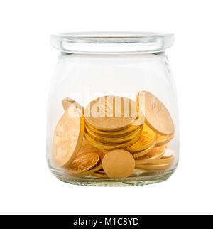 Goldmünzen im Glas zu Einsparungen oder Investitionen darstellen, Stockfoto