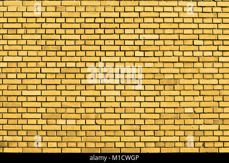 gelbe Ziegel Wand Hintergrund Stockfoto