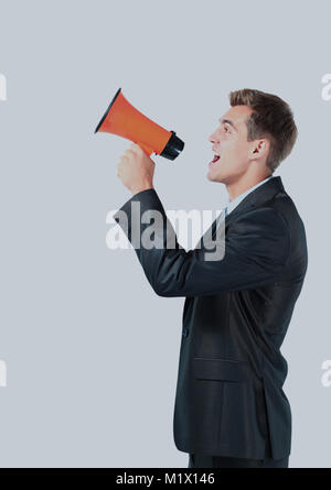 Business Mann laut in ein Megaphon zu schreien. Stockfoto