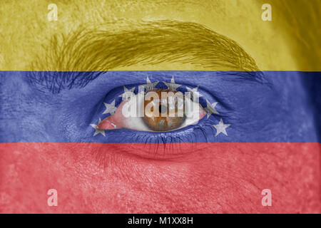 Menschliches Gesicht und Augen, mit Flagge Venezuela lackiert Stockfoto