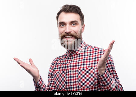 Angenehme bärtiger Mann suchen angenehm überrascht Stockfoto