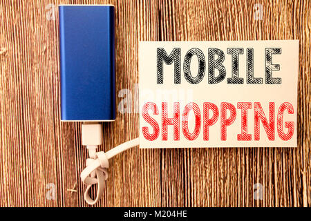 Konzeptionelle Hand schreiben Bildunterschrift Inspiration zeigt das Mobile Einkaufen. Business Konzept für Handys online bestellen auf haftnotiz Holz Holz geschrieben Stockfoto