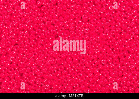 Seed beads der leuchtend rote Farbe. Stockfoto