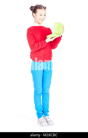 Schulmädchen holding Lunchbox Stockfoto