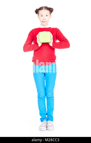 Schulmädchen holding Lunchbox Stockfoto