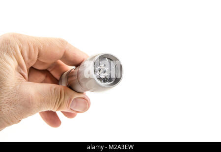 Kleine home pocket LED-Taschenlampe in der Hand auf dem weißen Stockfoto