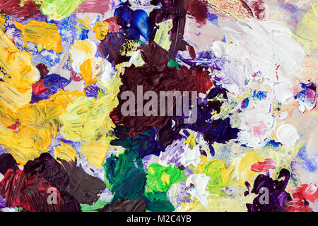 Bunte helle Flecken auf meiner Palette von Farben, Textur für den modernen, kreativen Hintergrund Stockfoto