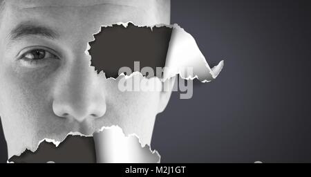 Mans Gesicht mit zerrissenem Papier Stockfoto