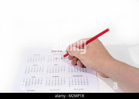 Valentinstag abstrakten Foto. Kalender mit Bleistift auf weißem Hintergrund. Stockfoto