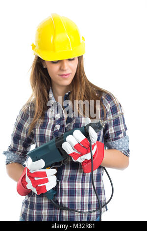 Attraktive junge Frau Builder mit Bohrer Werkzeug für gute Arbeit zufrieden. Auf weissem Hintergrund. Stockfoto
