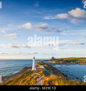 Castlepoint Leuchtturm, Wairarapa, Neuseeland, bei Sonnenaufgang. Stockfoto