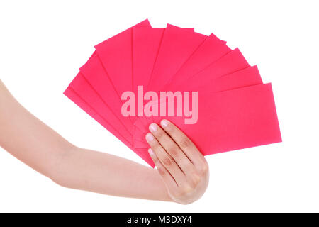 Hand mit roten Umschlag im Konzept der happy Chinese New Year auf weißem Hintergrund Stockfoto