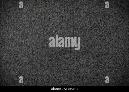 Schwarzer Teppich oder schwarzem Wollstoff Textur closeup und Muster Hintergrund Stockfoto