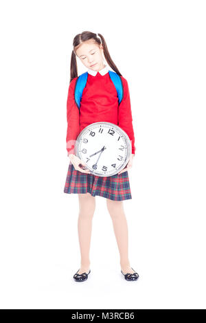 School Girl holding Wecker Stockfoto