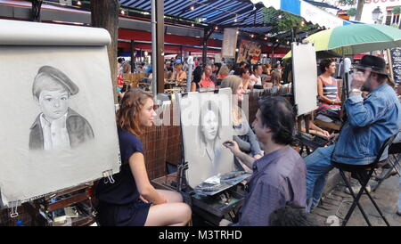 Straßenkünstler, die Porträts in Montmartre, Paris, machen Stockfoto