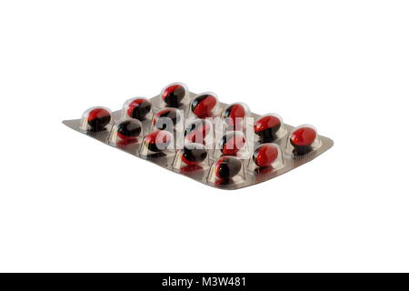 Rote Pillen in einem Blister auf weißem Hintergrund Stockfoto