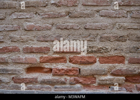 Mauer der alten, braunen und roten Ziegeln. Zusammenfassung Hintergrund Textur Stockfoto