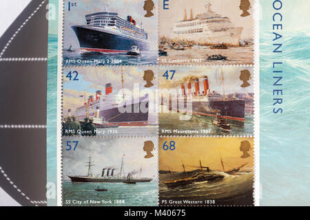 Alte britische Briefmarken mit alten und neuen Ozeanriesen Stockfoto