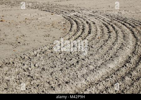 Sand beanspruchte Textur auf den Strand am Morgen Stockfoto