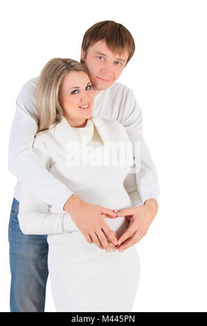 Herz aus Händen am Bauch der schwangeren Frau Stockfoto