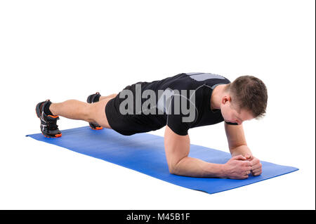 Junger Mann dabei Ellenbogen Plank Training Stockfoto