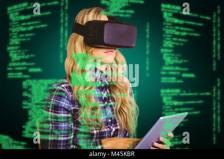 Zusammengesetztes Bild ziemlich lässig Arbeitnehmers mit Oculus rift Stockfoto