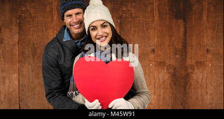 Zusammengesetztes Bild festliche Ehepaar in Winterkleidung Stockfoto