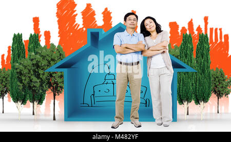 Zusammengesetztes Bild des Lächelns paar mit verschränkten Armen Stockfoto