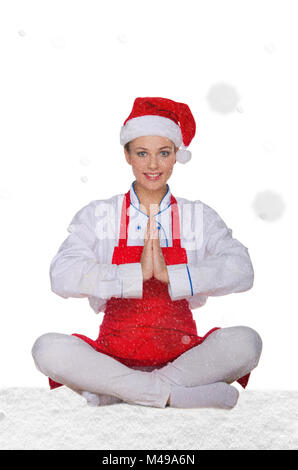 Koch in Hut von Santa Claus Yoga mit Schnee Stockfoto