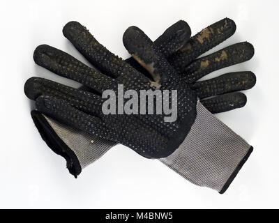 Alte schwarze Arbeit Handschuhe mit Polka Dots Stockfoto