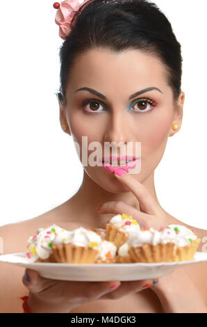 Beauty fashion model Mädchen mit bunten Kuchen Stockfoto