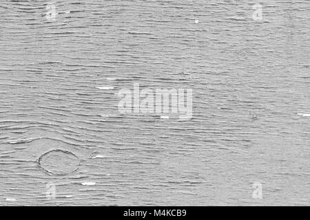 Nahaufnahme einer geknackt, verwitterte und lackiertem Sperrholz Textur Hintergrund in Schwarz und Weiß. Stockfoto