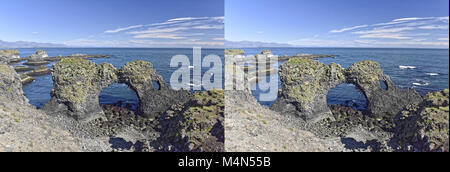 Küste und Klippen von Basaltgestein bei Arnarstapi Naturschutzgebiet durch Loch im Felsen gesehen. Snaefellsness Halbinsel, Island Stockfoto