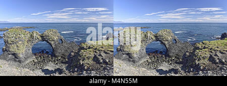 Küste und Klippen von Basaltgestein bei Arnarstapi Naturschutzgebiet durch Loch im Felsen gesehen. Snaefellsness Halbinsel, Island Stockfoto