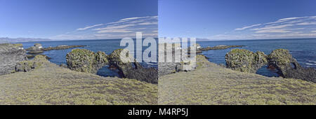 Küste und Klippen von Basaltgestein bei Arnarstapi Naturschutzgebiet durch Loch im Felsen gesehen. Snaefellsness Halbinsel, Island Stockfoto