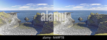 Küste und Klippen von Basaltgestein bei Arnarstapi Naturschutzgebiet durch Loch im Felsen gesehen. Snaefellsness Halbinsel, Island Stockfoto