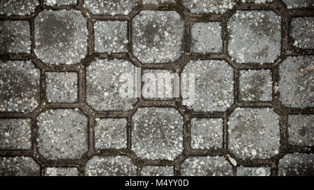 Steinboden Textur. Kopfsteinpflaster aus Granit Pflaster Hintergrund. Zusammenfassung Hintergrund der alten Kopfsteinpflaster close-up. Nahtlose Textur. in Oman Stockfoto