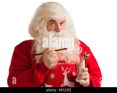 Santa Claus Spielzeug. Malerei und Färbung Weihnachten Dekoration von Angel Statue Stockfoto