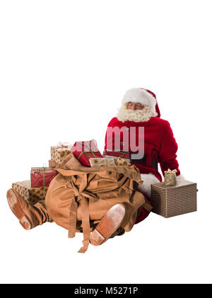 Santa Claus mit seiner großen Tasche voller Geschenke und Spielzeug voller Portrait sitzen Stockfoto