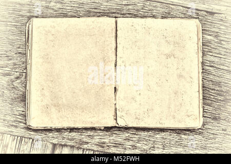 Ein altes Buch auf einem Holztisch. Country Style Stockfoto