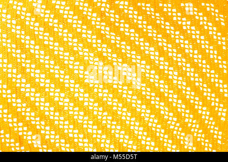 Gelb gestrickt Serviette Textur auf weißem Hintergrund Stockfoto