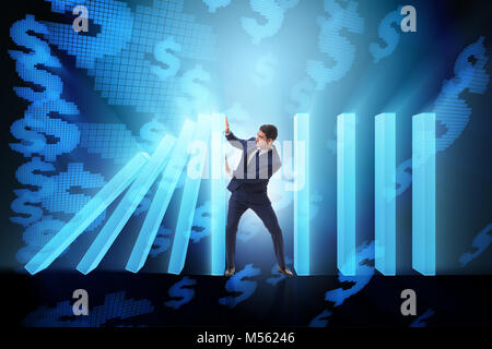 Der Geschäftsmann in Domino Effect Business Konzept Stockfoto
