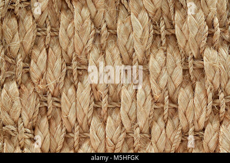 Nahaufnahme von Hand gewebt / gebunden Wolldecke Detail, gemusterten Sisal, Hanf Hintergrund Textur. Stockfoto