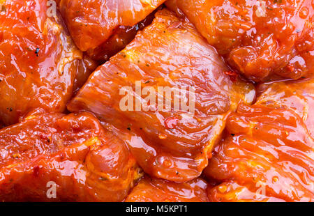 Rohes Schweinefleisch in Sauce, Textur Stockfoto